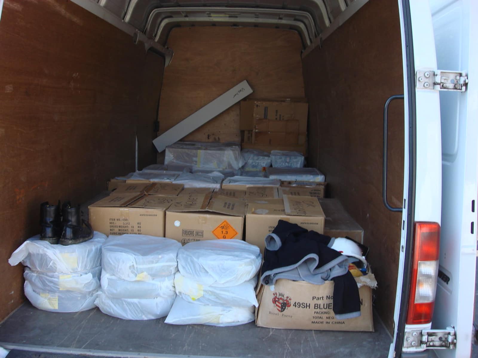 The inside of a loaded delivery van, boxes stacked for the run.